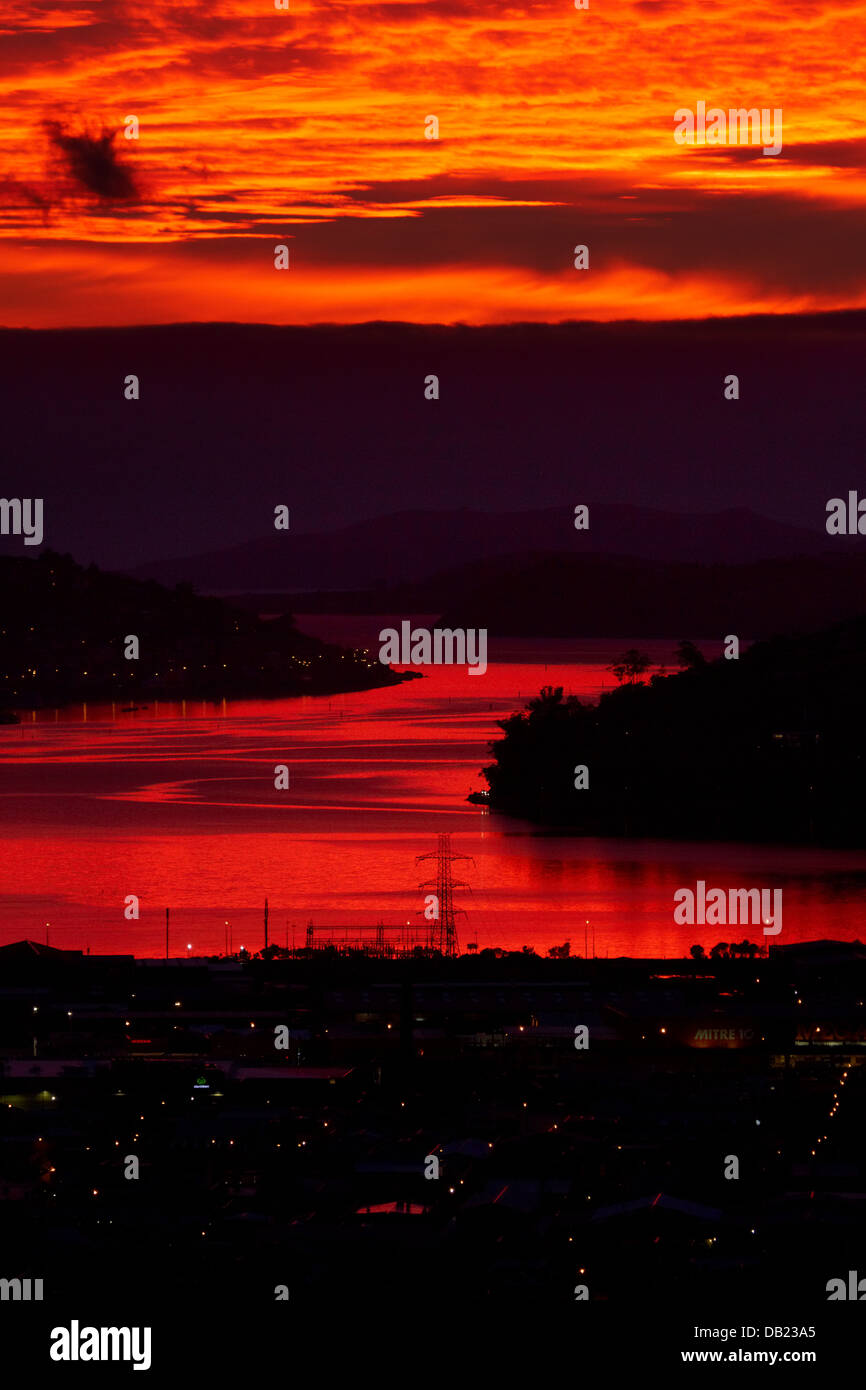 Sunrise reflected in Otago Harbour, Dunedin, Otago, South Island, New Zealand Stock Photo