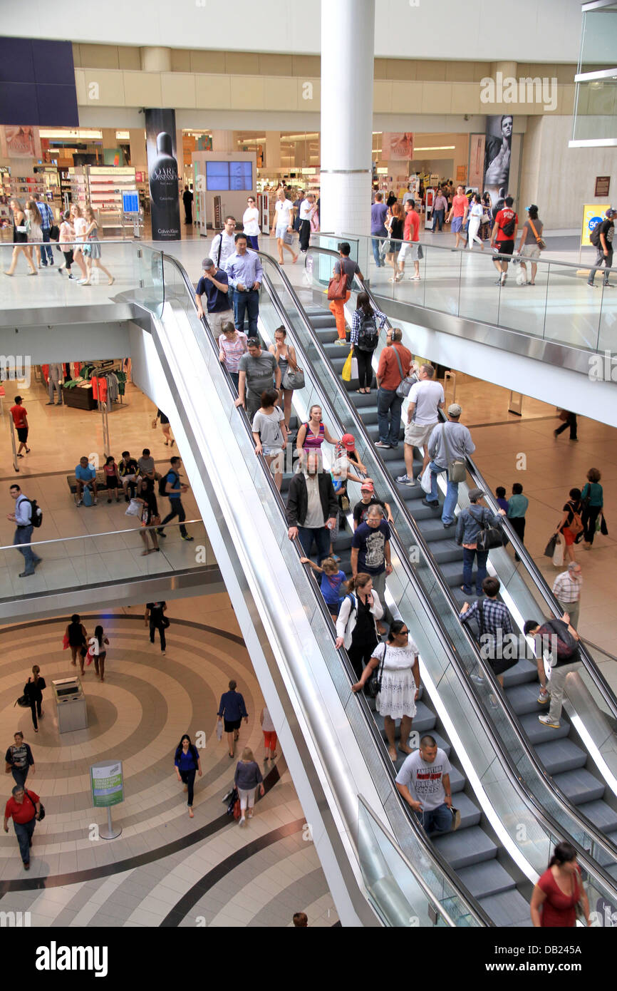 People riding an escalator at the Eaton Centre on July 12, 2013 in Toronto Stock Photo