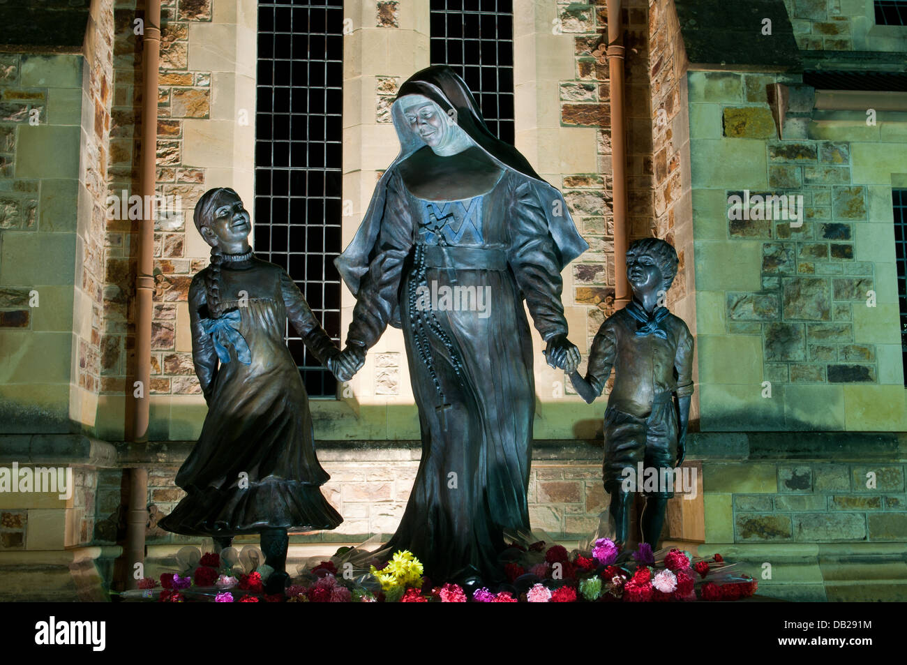 Mary Mackillop statue outside of StFranics Xavier Cathderal in Adelaide at night Stock Photo