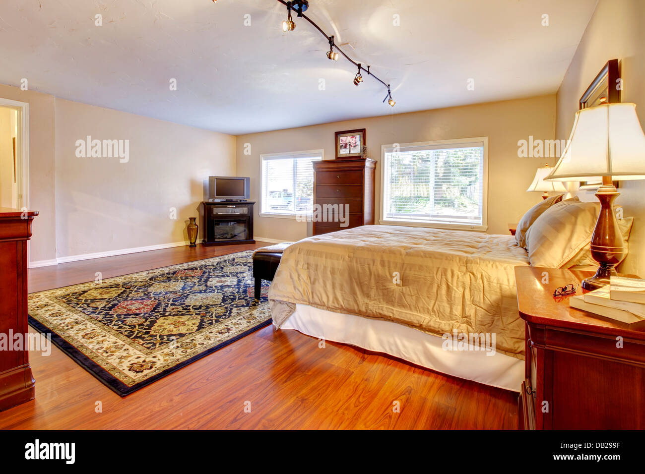 Large Bedroom With Hardwood Floor And Two Dressers Stock Photo