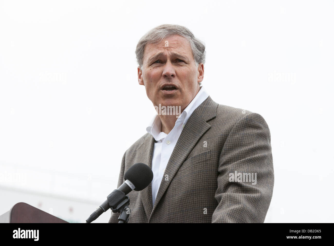 Governor Jay Inslee speaking at the dedication ceremony for the launch of the worlds largest tunneling machine, nicknamed Bertha, on July 20, 2013 in Seattle. The bored road tunnel is replacing the Alaskan Way Viaduct and will carry State Route 99 under Downtown Seattle from the SODO neighborhood to South Lake Union. The two mile long waterfront tunnel is scheduled to open in late 2015. Stock Photo