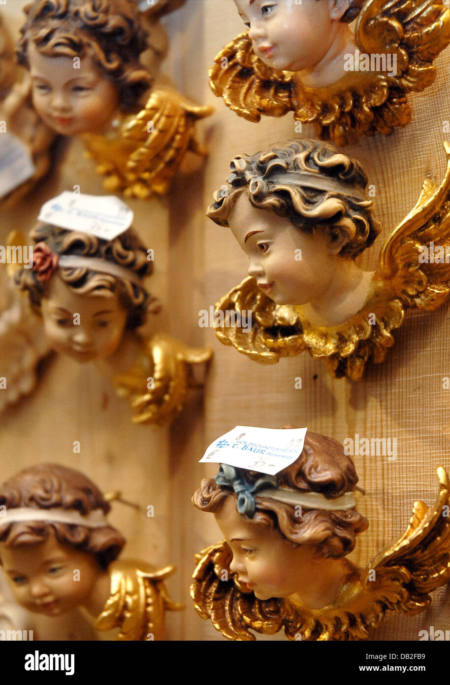 Angels carved from wood pictured through a mirror in Oberammergau