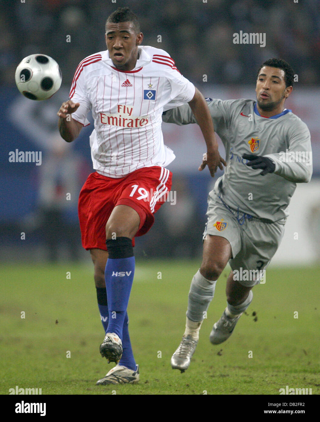 Jerome Boateng (L) of Hamburger SV vies for the ball with FC Basel player Carlos Alberto Alves Garcia 'Carlito' during the group D UEFA Cup match at HSH-Nordbank Arena in Hamburg, Germany, 20 December 2007. The match ended in a 1-1 draw. Photo: Sebastian Widmann Stock Photo