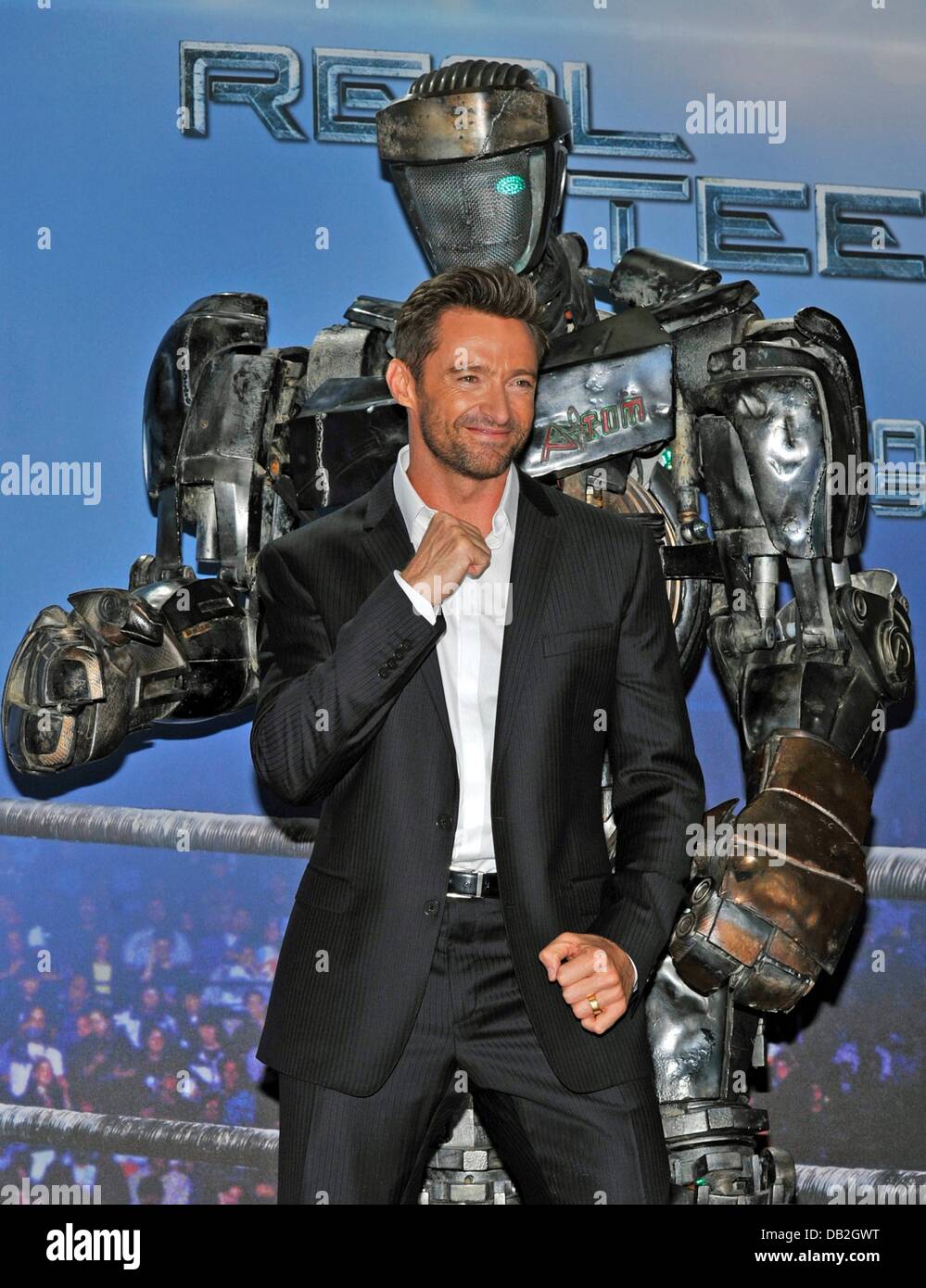 Australian actor Hugh Jackman poses with the robot 'Atom' during a  photocall for the film 'Real Steel in Munich, Germany, 12 September 2011.  The film arrives German cinemas on 10 November 2011