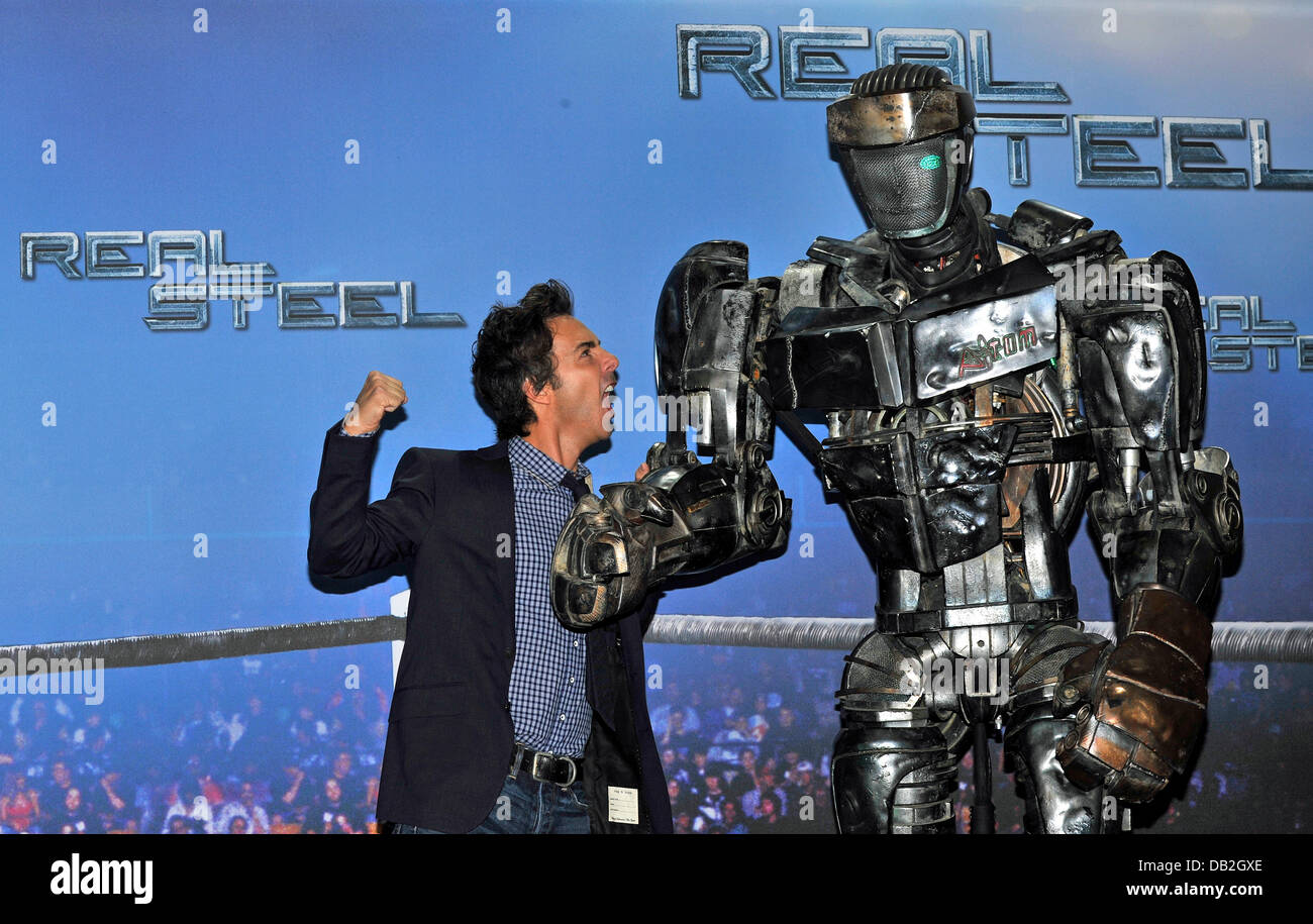 US-Canadian director Shawn Levy poses with robot 'Atom' during a photocall  for the film 'Real Steel in Munich, Germany, 12 September 2011. The film  arrives German cinemas on 10 November 2011 and