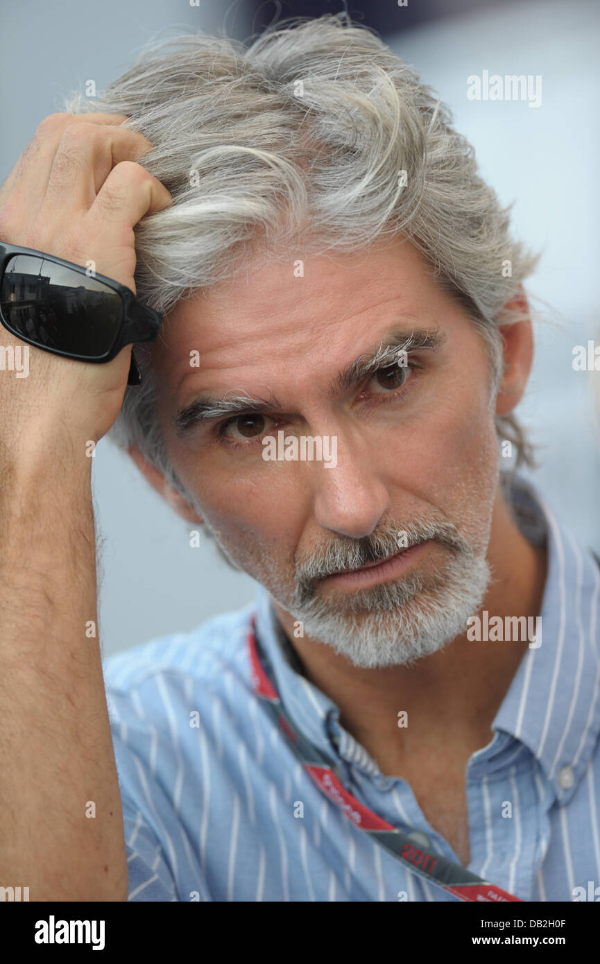 Former British Formula One champion Damon Hill walks through the paddock at the race track Autodromo Nazionale Monza, Italy, 10 September 2011. The Formula One Grand Prix of Italy will take place on 11 September 2011. Photo: David Ebener dpa Stock Photo