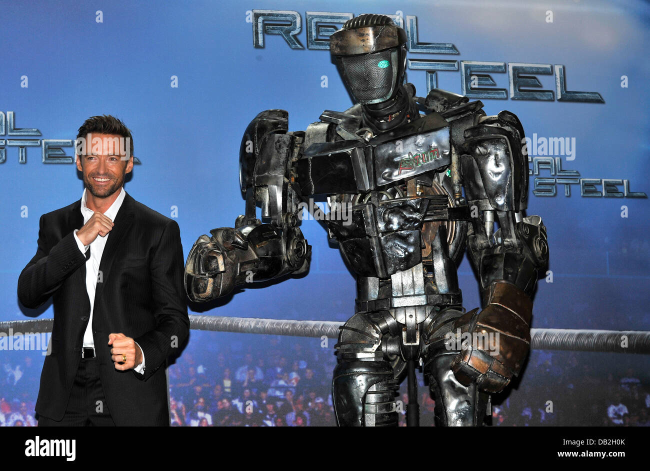 Australian actor Hugh Jackman poses with the robot 'Atom' during a  photocall for the film 'Real Steel in Munich, Germany, 12 September 2011.  The film arrives German cinemas on 10 November 2011