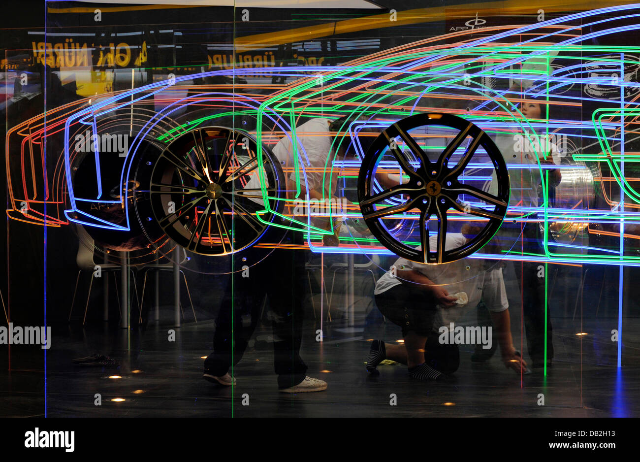 A rim manufacturer presents its designs on several colourful plexiglass