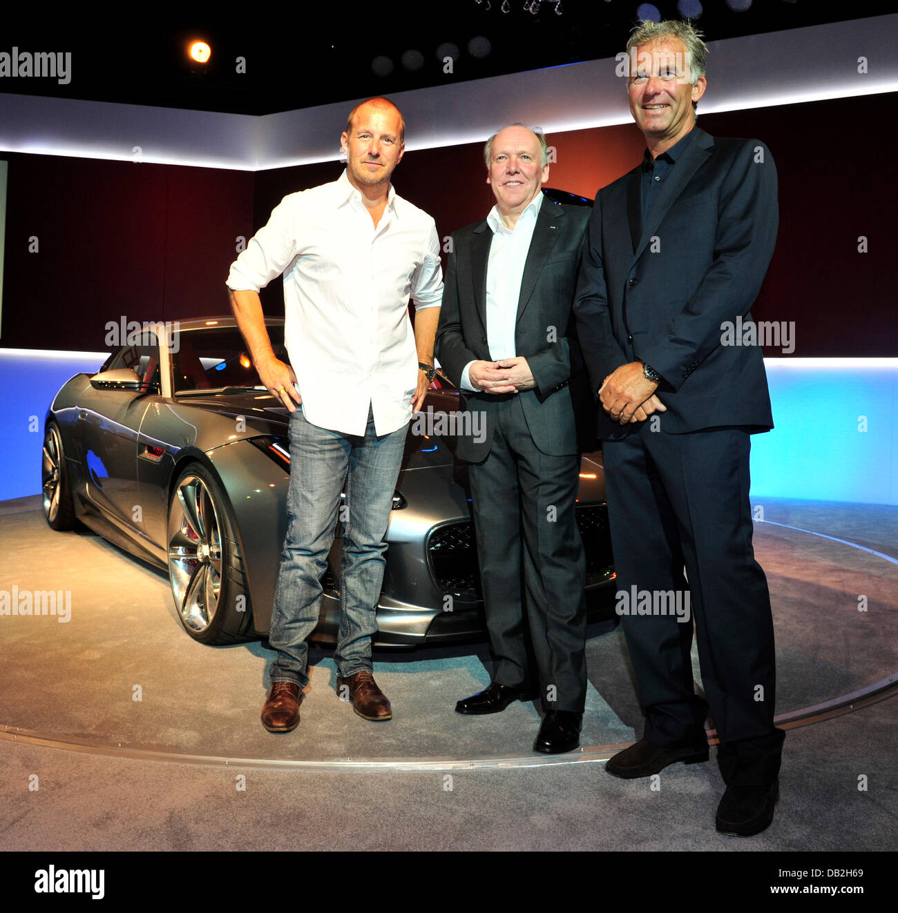 German actor Heino Ferch (from L) stands together with Ian Callum, head designer for Jaguar, and former race driver Christian Danner stand next to the concept sports car Jaguar C-X16 after its presentation at Palais Thurn und Taxis at the International Motor Show IAA in Frankfurt Main, Germany, 12 September 2011. From 15 to 25 September 2011 exhibitors from all over the world will  Stock Photo