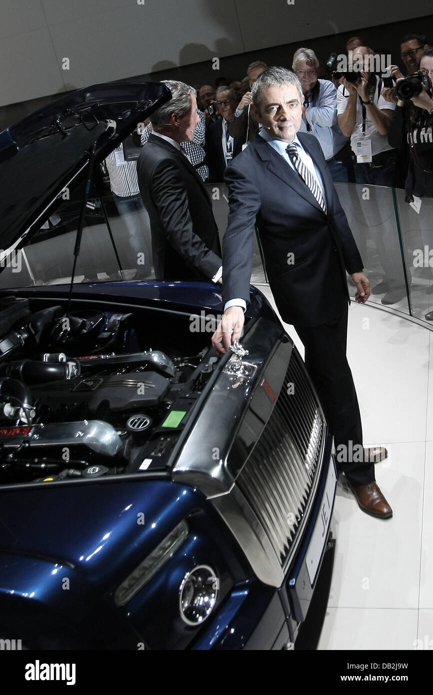 CEO of Rolls-Royce, Torsten Mueller-Oetvoes (L) and comedian Rowan Atkinson (Mr. Bean) present the new Rolls-Royce 'Ghost' at the International Motor Show IAA in Frankfurt Main, Germany, 13 September 2011. From 15 to 25 September 2011 exhibitors from all over the world will present new trends of the automotive industry, headed by electronic mobility and hybrid vehicles. Photo: Fred Stock Photo