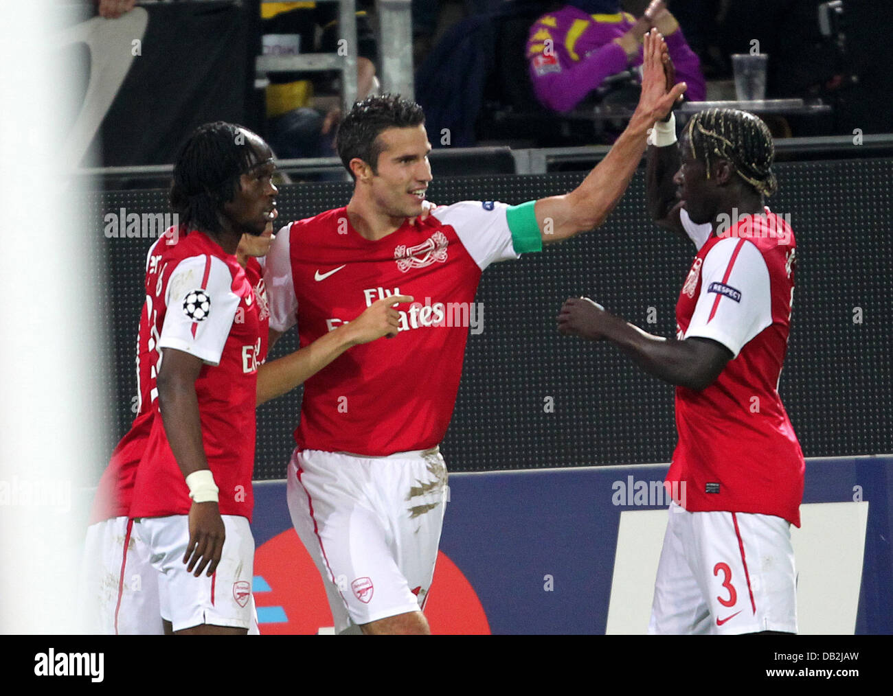 Robin van Persie (C) of Arsenal celebrates 0-1 goal with Bacary Sagna (r) and Gervinho during the Champions League group F soccer match between Borussia Dortmund and Arsenal FC at Signal-Iduna-Park stadium in Dortmund, Germany, 13 September 2011. Photo: Roland Weihrauch dpa/lnw  +++(c) dpa - Bildfunk+++ Stock Photo