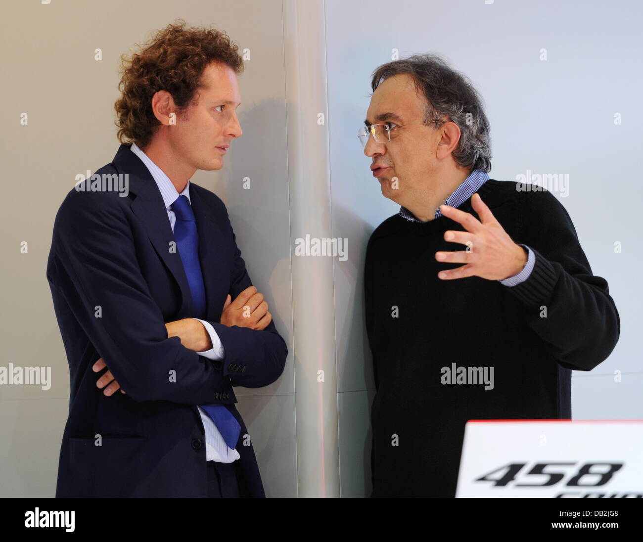 Fiat President John Elkann (L) and head of Fiat Sergio Marchionne talk during a press conference of the car manufacturer Ferrari at the International Motor Show IAA in Frankfurt Main, Germany, 13 September 2011. From 15 to 25 September 2011 exhibitors from all over the world will present new trends of the automotive industry, headed by electronic mobility and hybrid vehicles. Photo Stock Photo