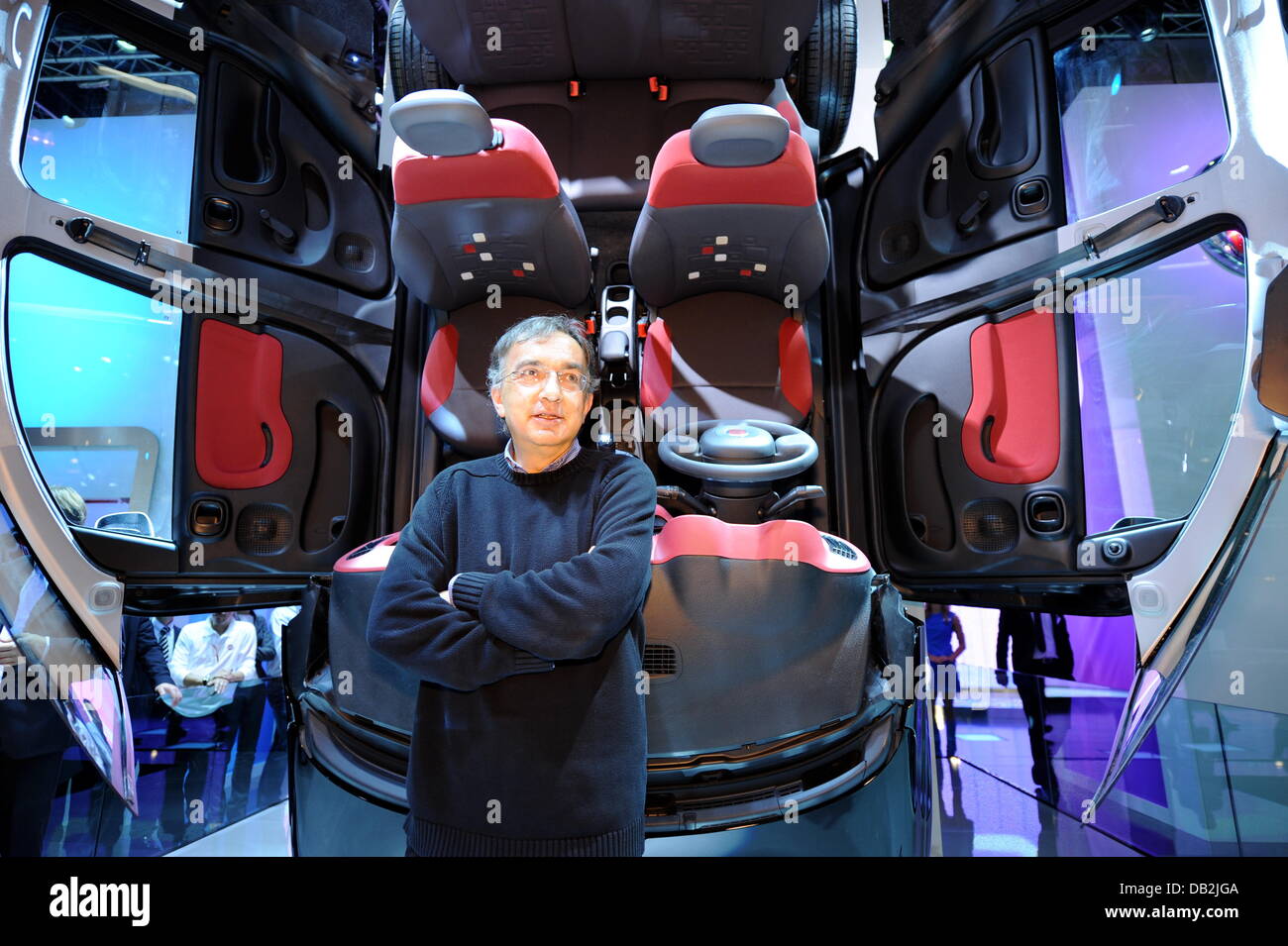 Head of Fiat Sergio Marchionne stands next to an open Fiat Panda during a press conference of the car manufacturer Ferrari at the International Motor Show IAA in Frankfurt Main, Germany, 13 September 2011. From 15 to 25 September 2011 exhibitors from all over the world will present new trends of the automotive industry, headed by electronic mobility and hybrid vehicles. Photo: Arne Stock Photo