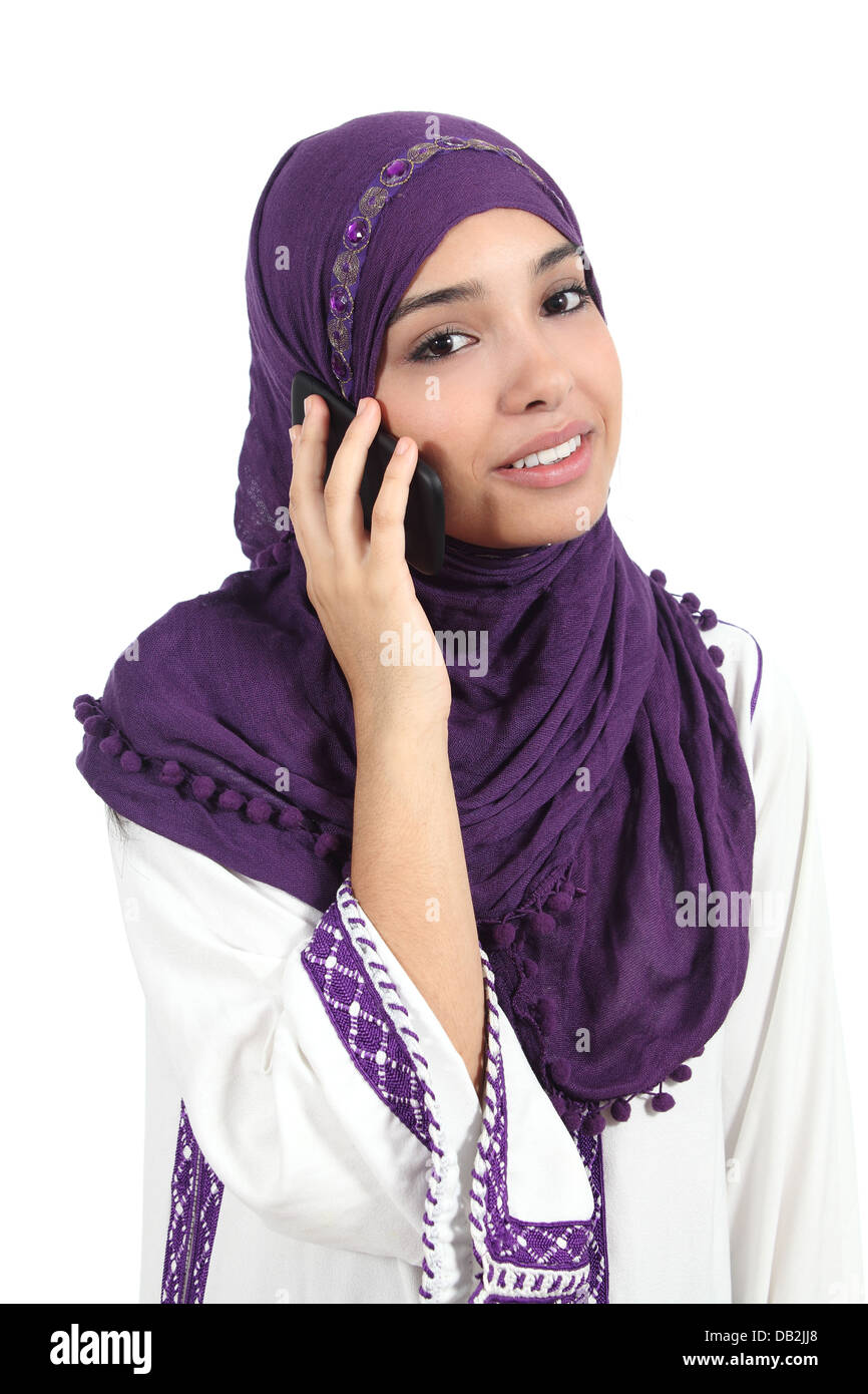 Beautiful arab woman wearing a hijab on the phone isolated on a white background Stock Photo