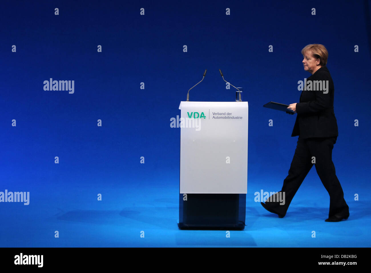 German chancellor Angela Merkel walks to the lecturn during the official opening ceremony of the International Motor Show IAA in Frankfurt Main, Germany, 15 September 2011. From 15 to 25 September 2011 exhibitors from all over the world will present new trends of the automotive industry, headed by electronic mobility and hybrid vehicles. Photo: FREDRIK VON ERICHSEN Stock Photo