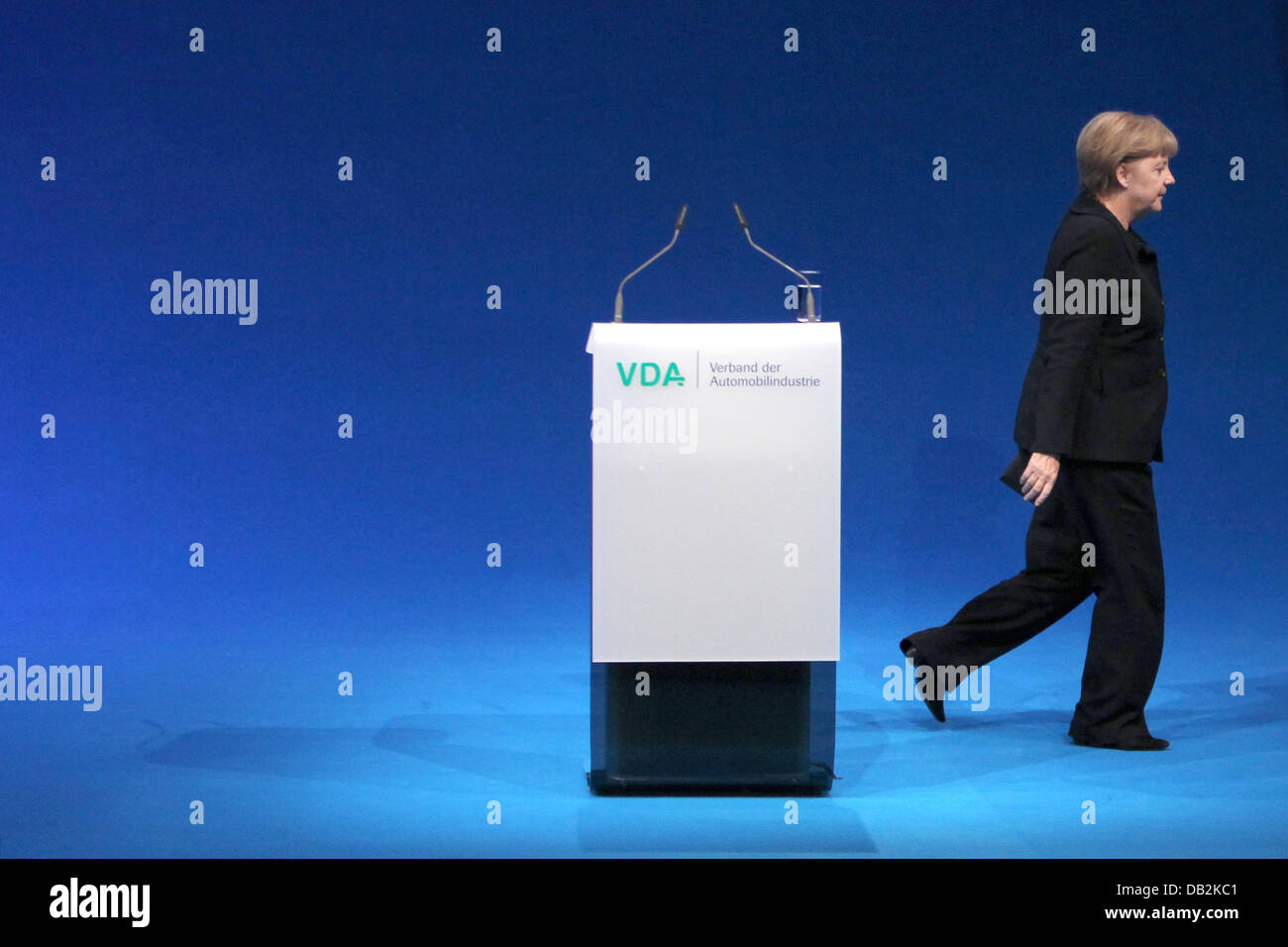 German chancellor Angela Merkel leaves the lecturn after her speech during the official opening ceremony of the International Motor Show IAA in Frankfurt Main, Germany, 15 September 2011. From 15 to 25 September 2011 exhibitors from all over the world will present new trends of the automotive industry, headed by electronic mobility and hybrid vehicles. Photo: FREDRIK VON ERICHSEN Stock Photo