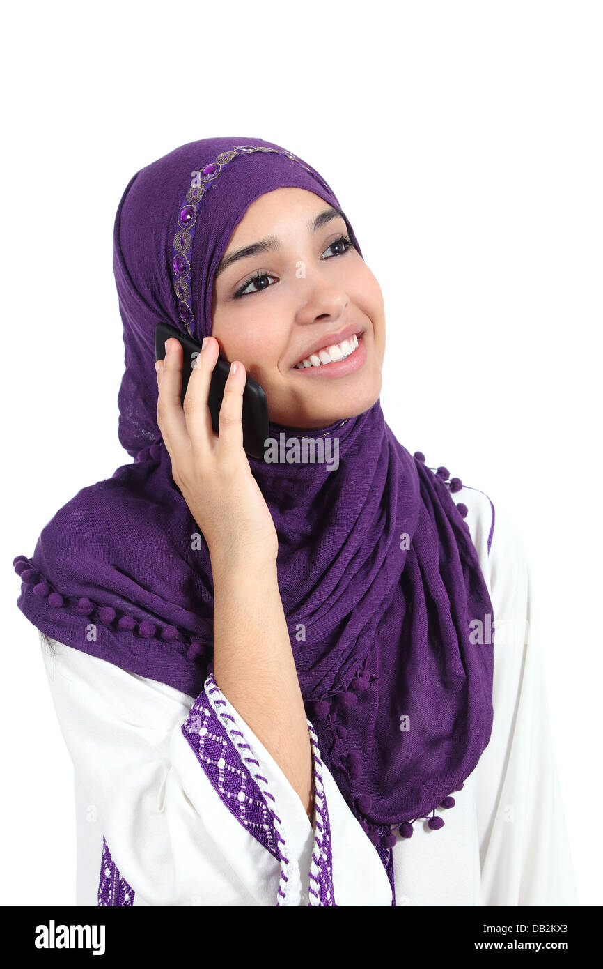 Beautiful muslim woman wearing a hijab talking on the mobile phone ...