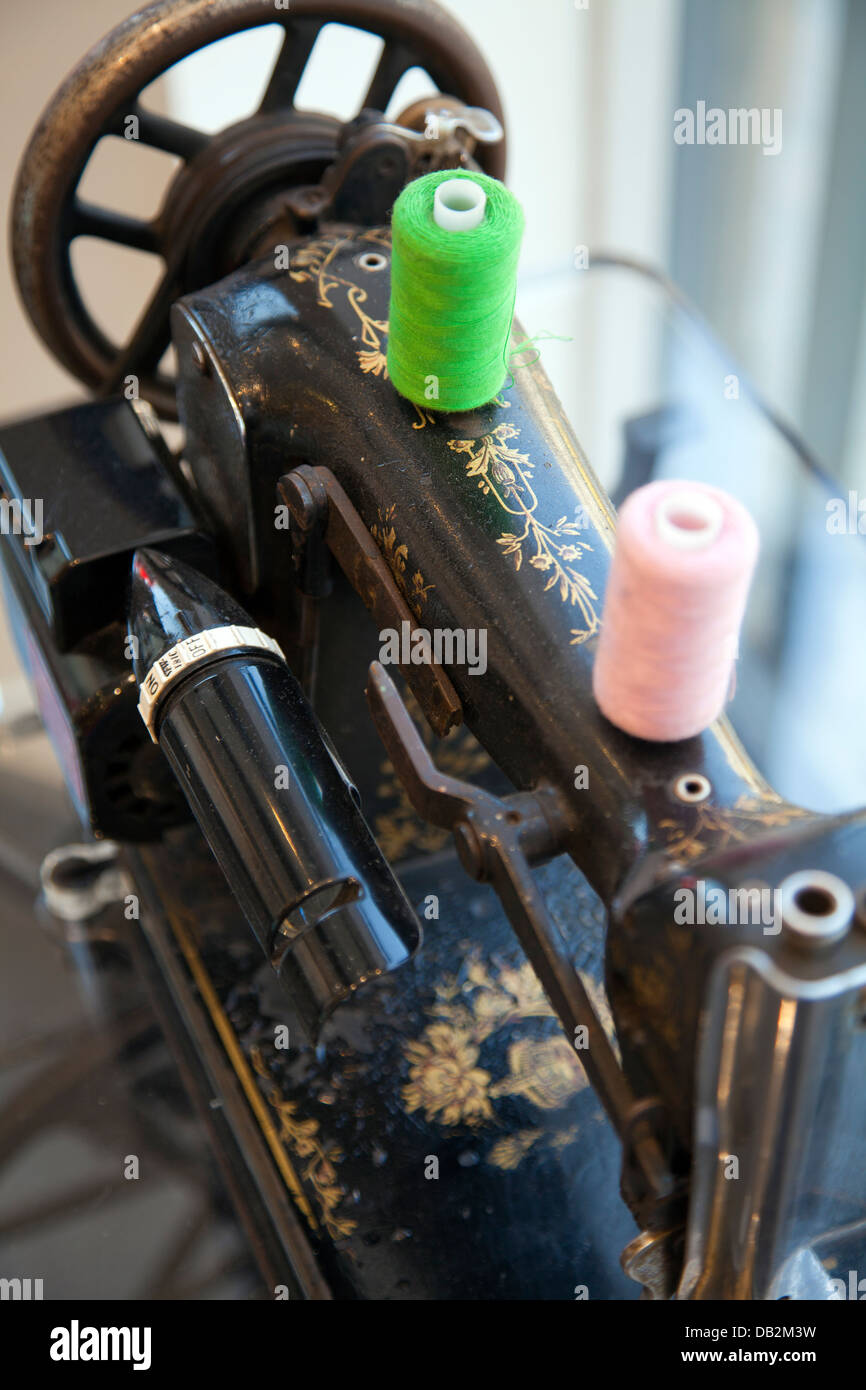 Old Pfaff Sewing Machine in Laundry Shop Window London UK Stock Photo