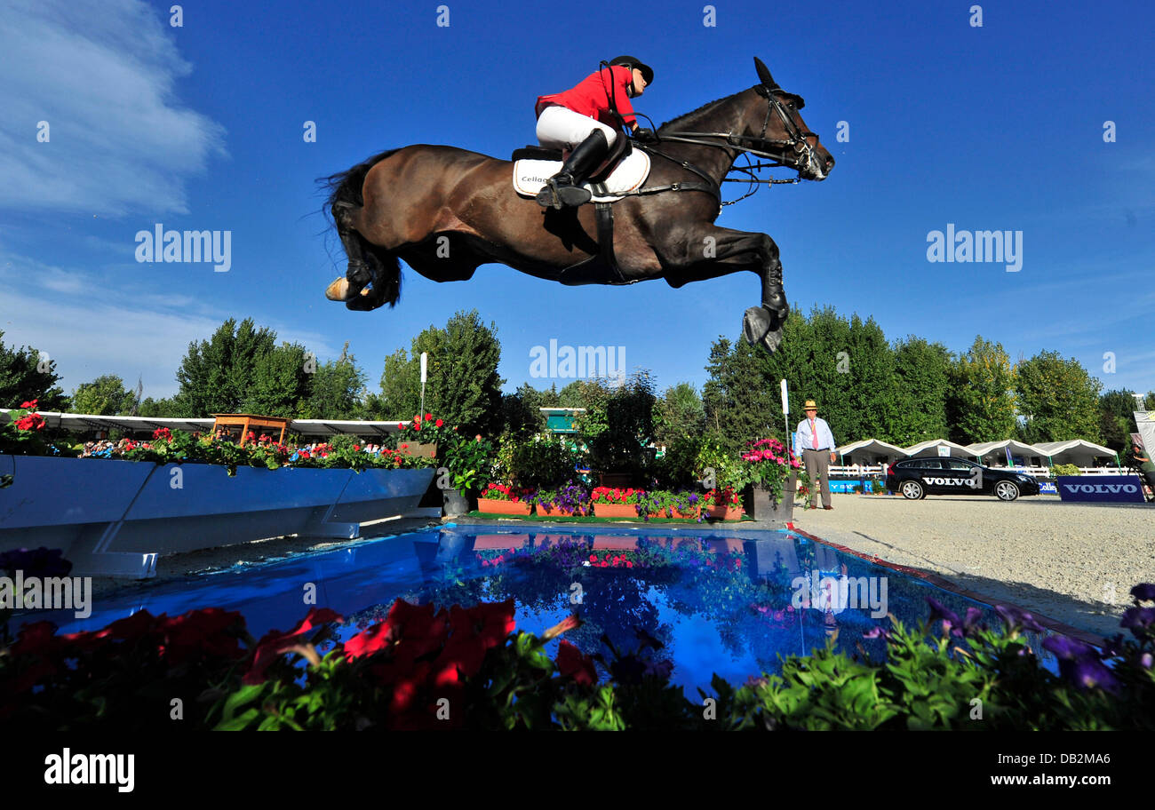 German show jumper JanneFriederike Meyer jumps a water obstacle on her