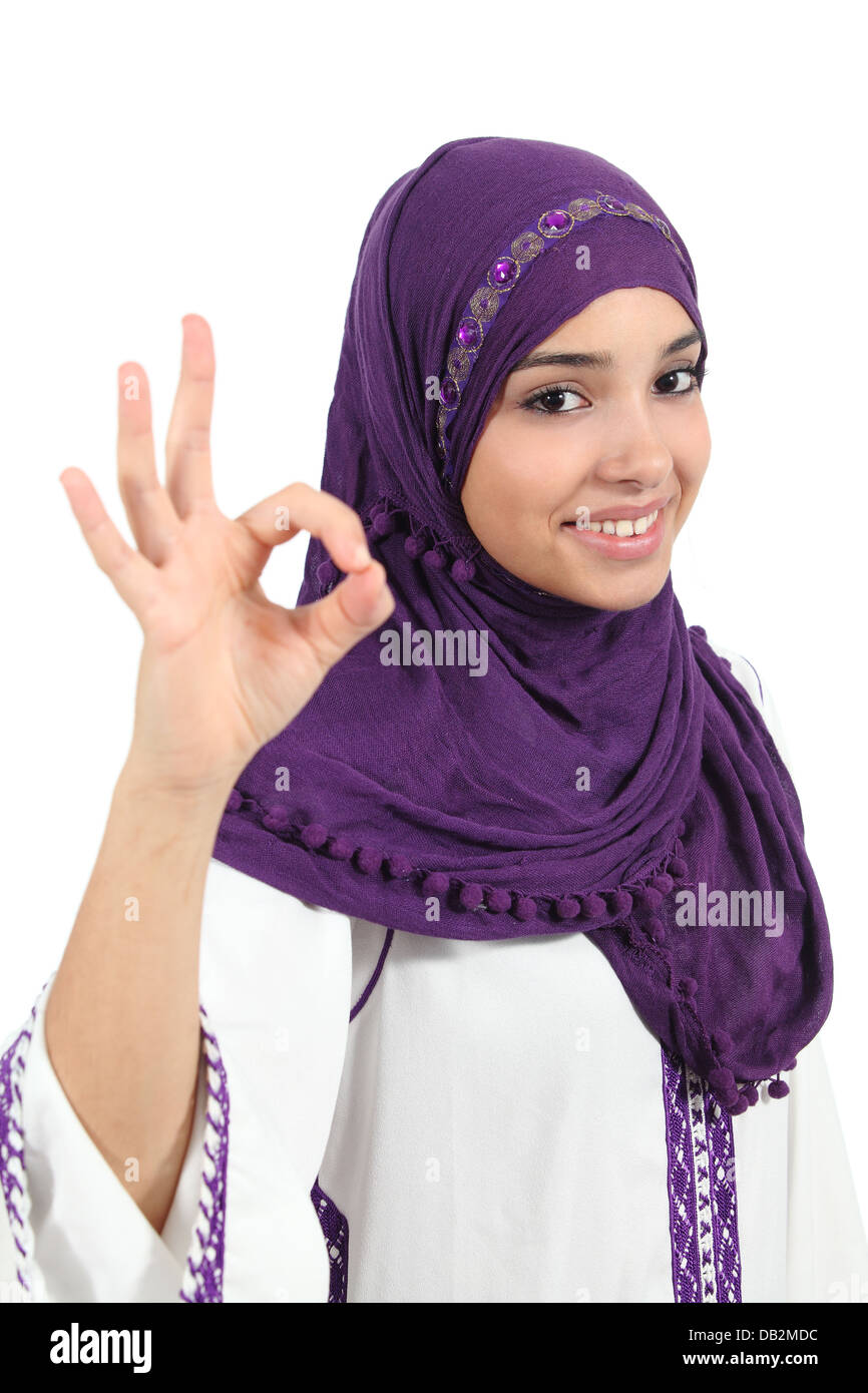 Beautiful happy muslim woman wearing a hijab gesturing ok isolated on a white background Stock Photo