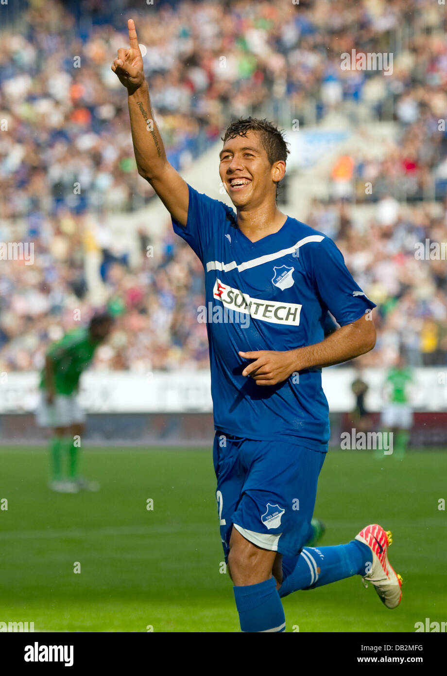 Hoffenheim's Roberto Firmino celebrates his 3-1 goal during the German  Bundesliga soccer match between 1899 Hoffenheim and VfL Wolfsburg at  Rhein-Neckar-Arena in Sinsheim, Germany, 17 September 2011. Photo: UWE  ANSPACH (ATTENTION: EMBARGO