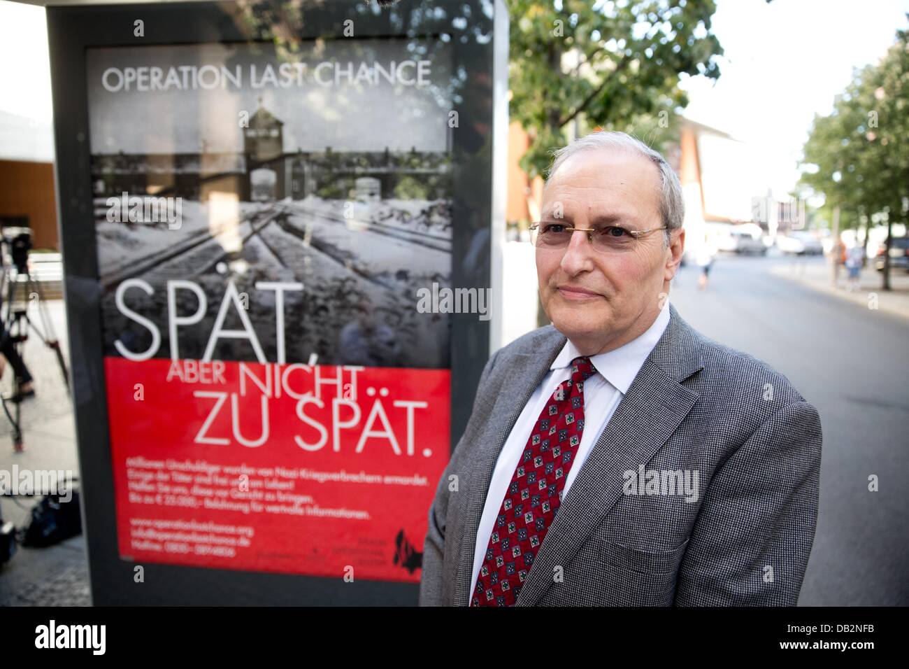 Director of the Simon Wiesenthal Centre in Jerusalem, EfraimZuroff, stands in front of a poster at the start of the poster campaign 'Late. But not too late! Operation Last Chance II' in Berlin, Germany, 23 July 2013. The campaign aims to find non-sentenced Nazi war criminals with help fromthe population and try them in court. Photo: JOERG CARSTENSEN Stock Photo