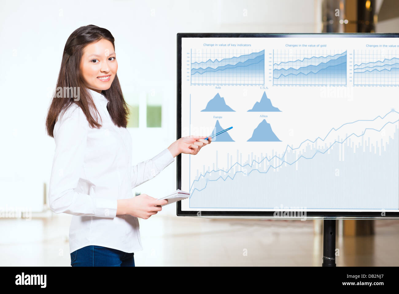 young business woman shows map of world Stock Photo - Alamy