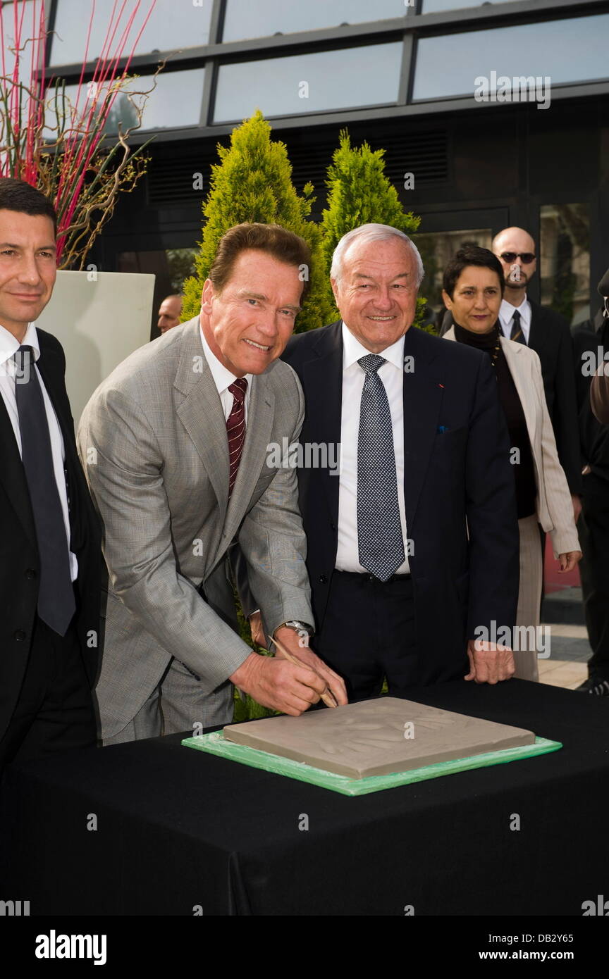 Paul Zilk, Ceo of Reed Midem, Arnold Schwarzenegger and Cannes Mayor Bernard Brochand  attend a 'Handprint Ceremony' during MIPTV Cannes, France - 04.04.11 Stock Photo