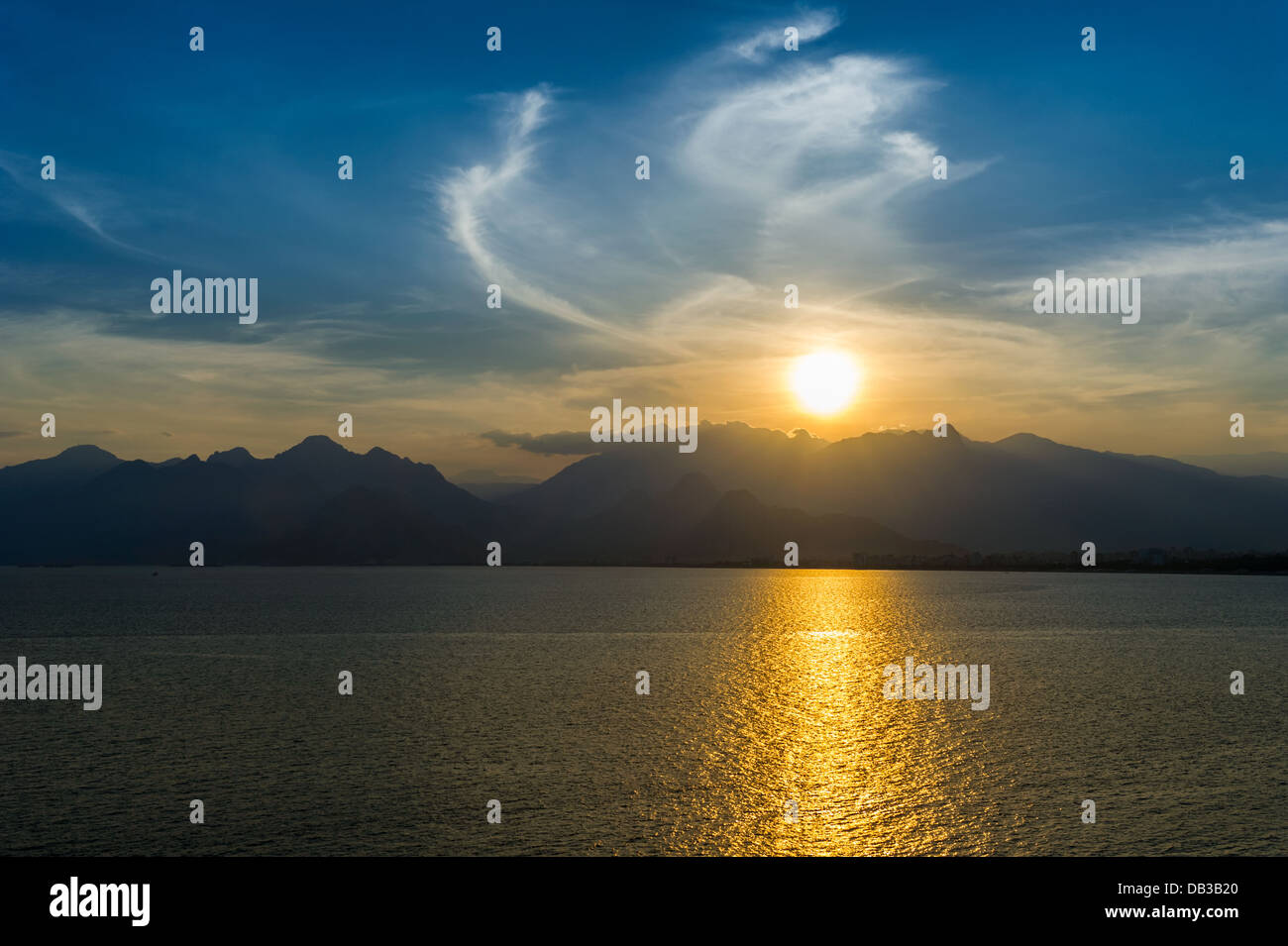 Lanscape of sunset over mountains and sea Stock Photo - Alamy