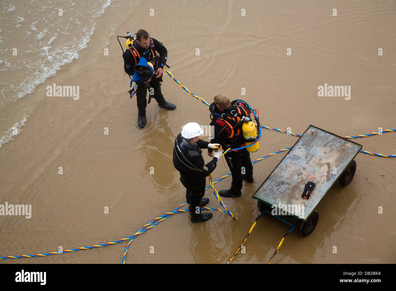 Diver preparing themselves by sea in full equipment UK Stock Photo