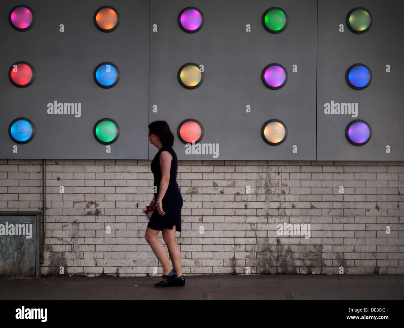 Walking past a colorful lighting installation in Southwark,London Stock Photo