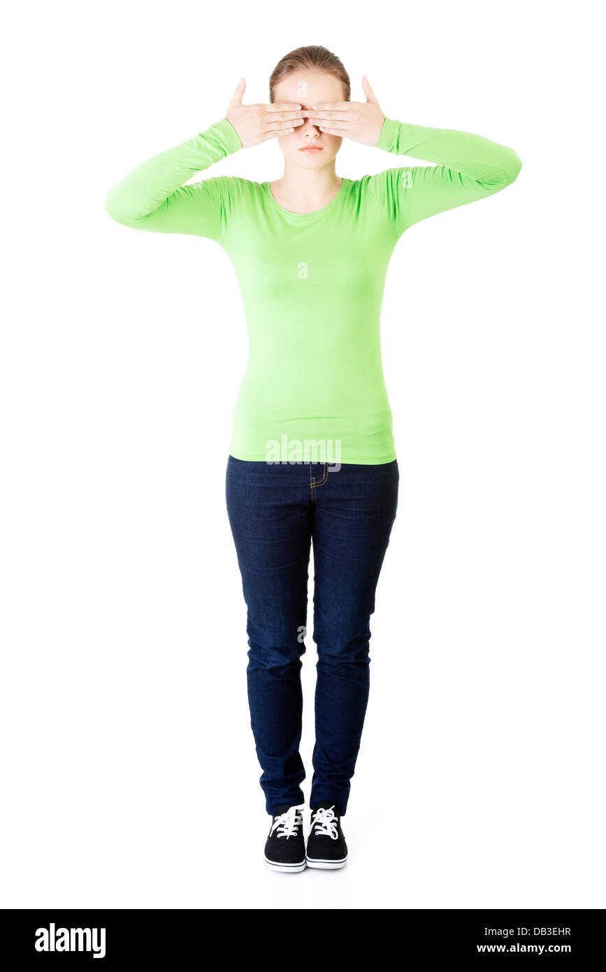 Young teen woman covering her face with hands, isolated on white Stock ...