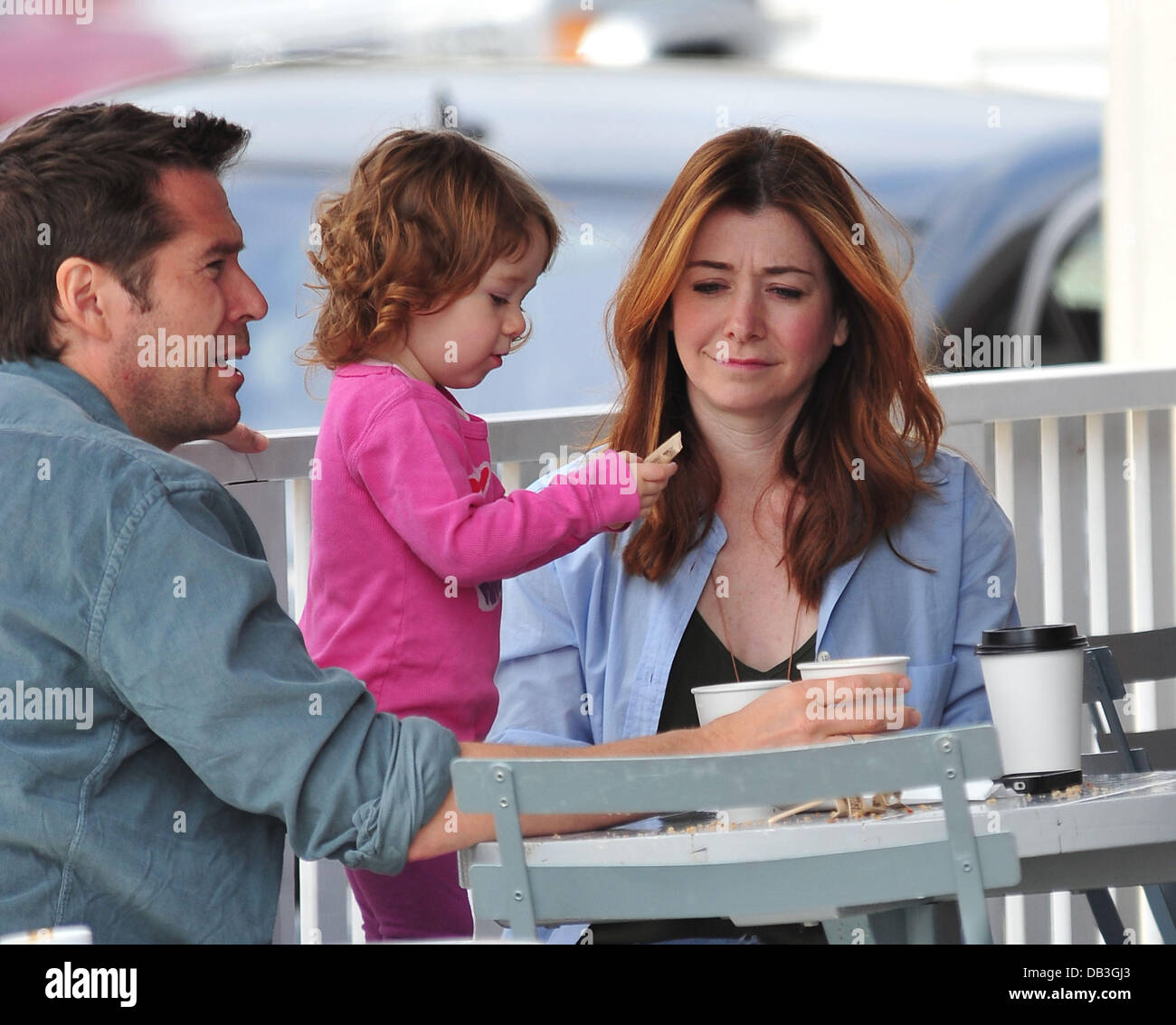 Alyson Hannigan Satyana Marie Denisof Alyson Hannigan, husband Alexis Denisof and their daughter Satyana Marie  Denisof at Brentwood Mart Brentwood, California - 13.04.11 Stock Photo -  Alamy
