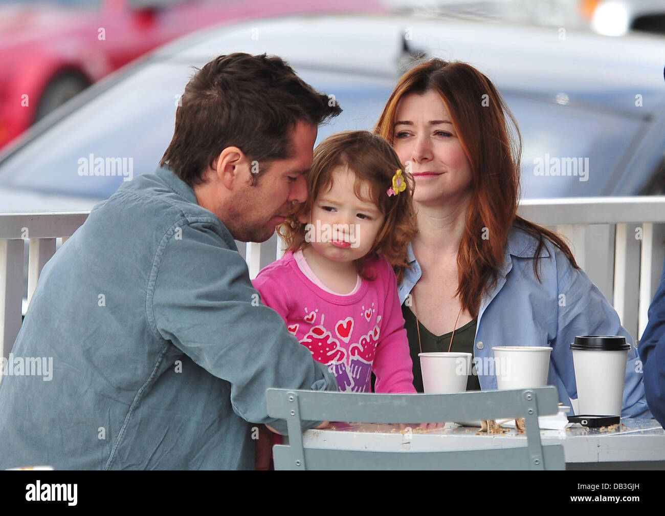 Alyson Hannigan Satyana Marie Denisof Alyson Hannigan, husband Alexis Denisof and their daughter Satyana Marie  Denisof at Brentwood Mart Brentwood, California - 13.04.11 Stock Photo -  Alamy