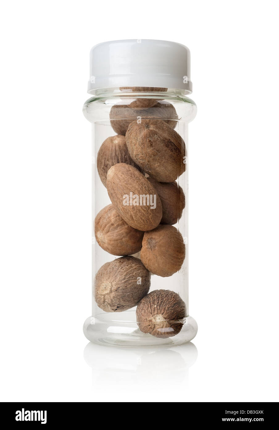 Nutmegs in a glass jar isolated on white Stock Photo