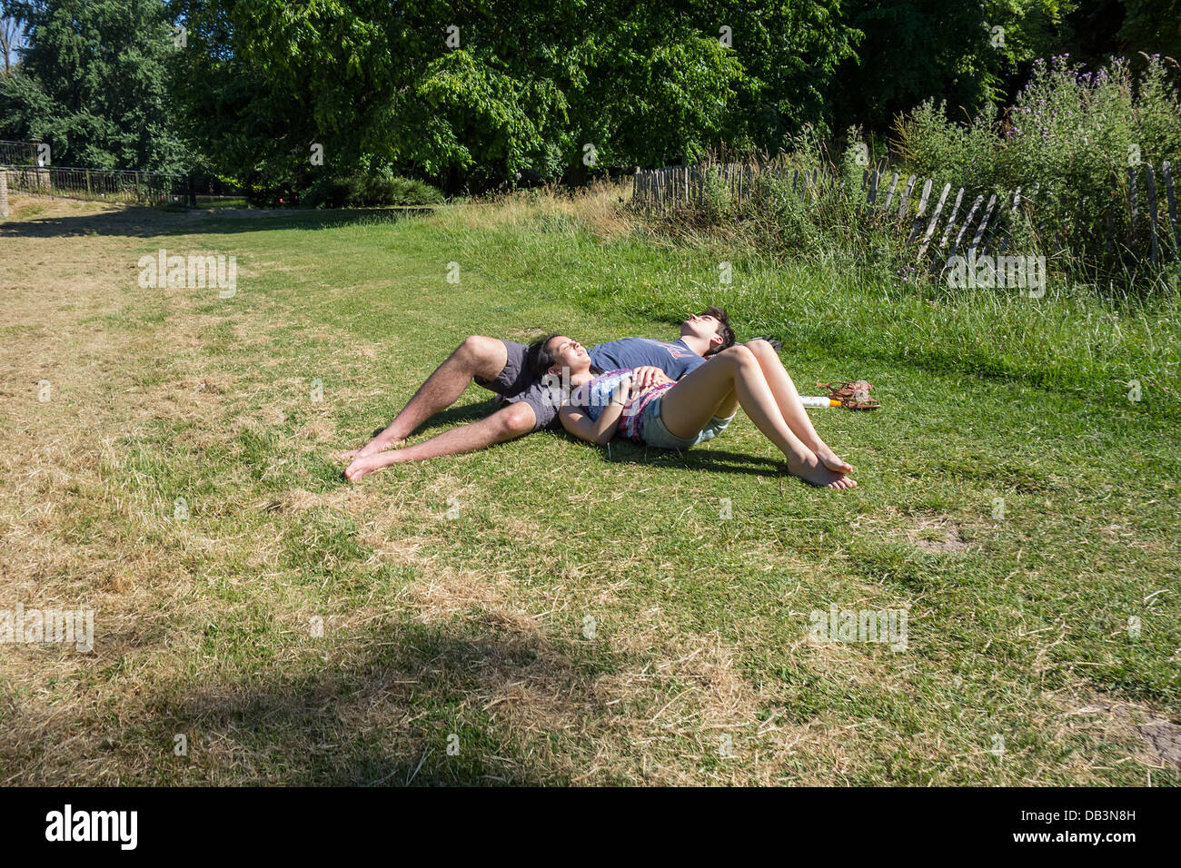 Young Couple Asleep in the Sun Stock Photo