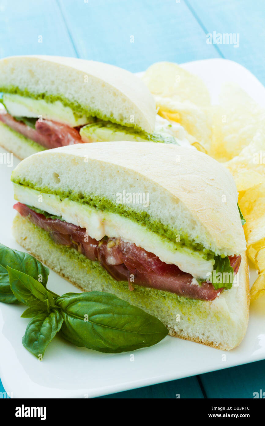Gourmet caprese sandwich with chips on the side Stock Photo Alamy