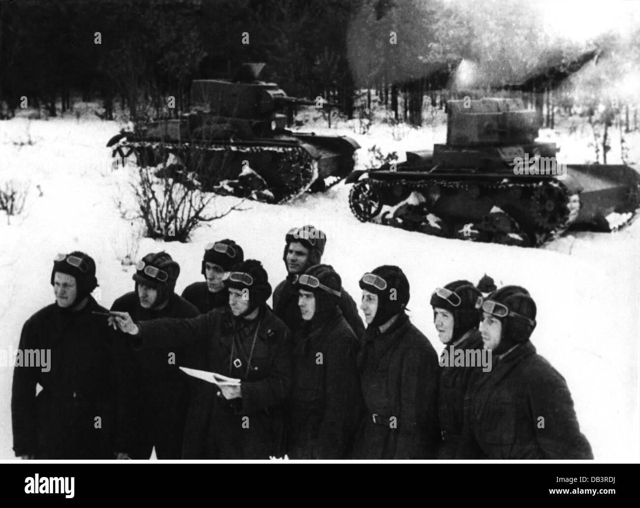 military, Russia, soldiers of a Red Army tank unit during a briefing, circa 1939, in the background two T-26 light tanks, officer, Soviet Union, USSR, forest, wood, snow, winter, drivers, T26, T 26, 20th century, historic, historical, training, people, 1930s, 1940s, Additional-Rights-Clearences-Not Available Stock Photo