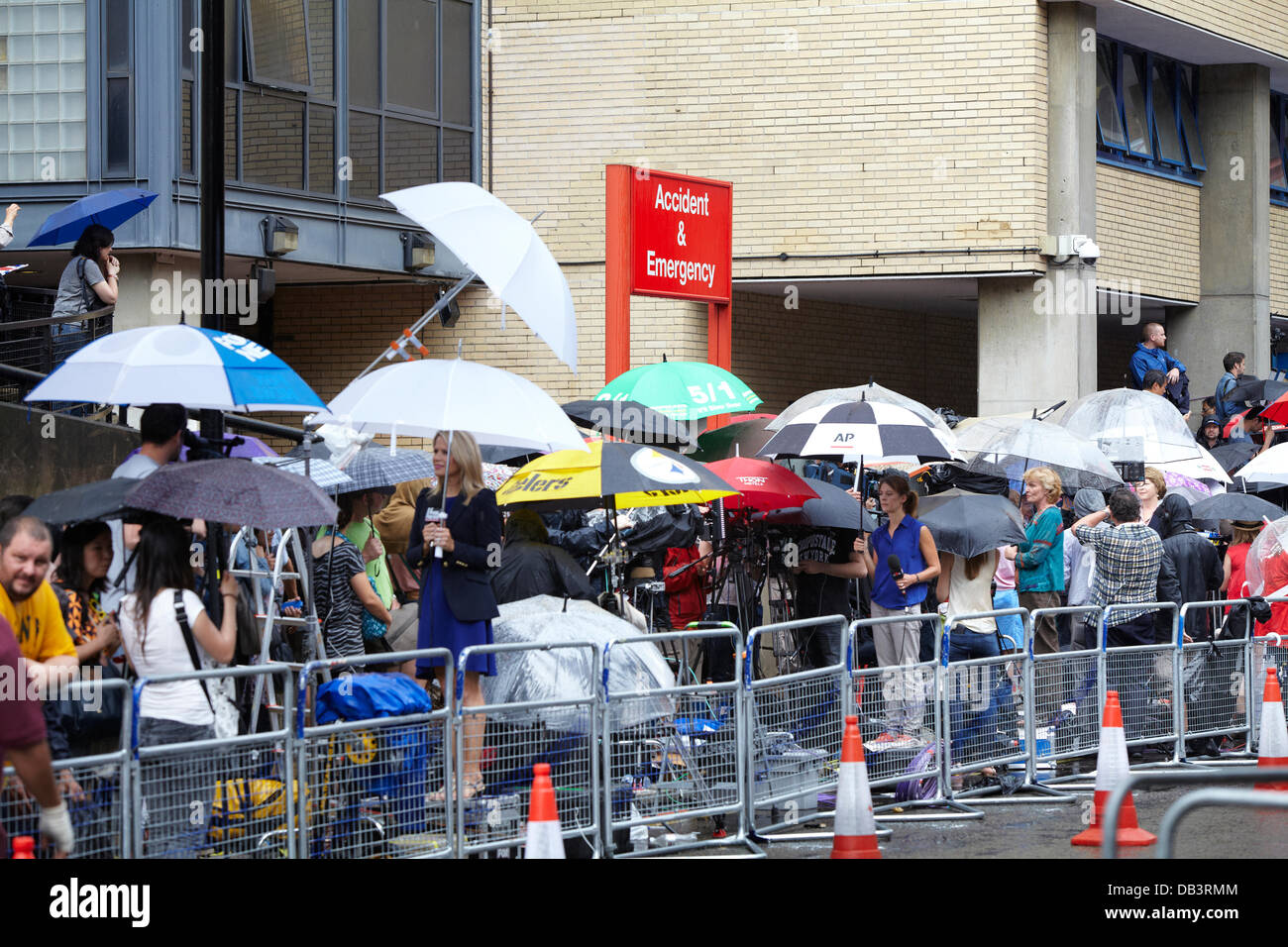London, UK. 23rd July 2013. Press wait in the rain  outside the Lindo Wing of Saint Mary's Hospital. Tuesday 23rd July 2013 Credit:  Sam Barnes/Alamy Live News Stock Photo