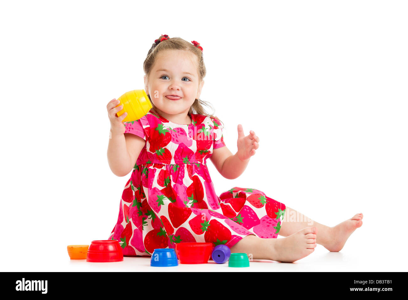 kid girl playing with cup toys Stock Photo