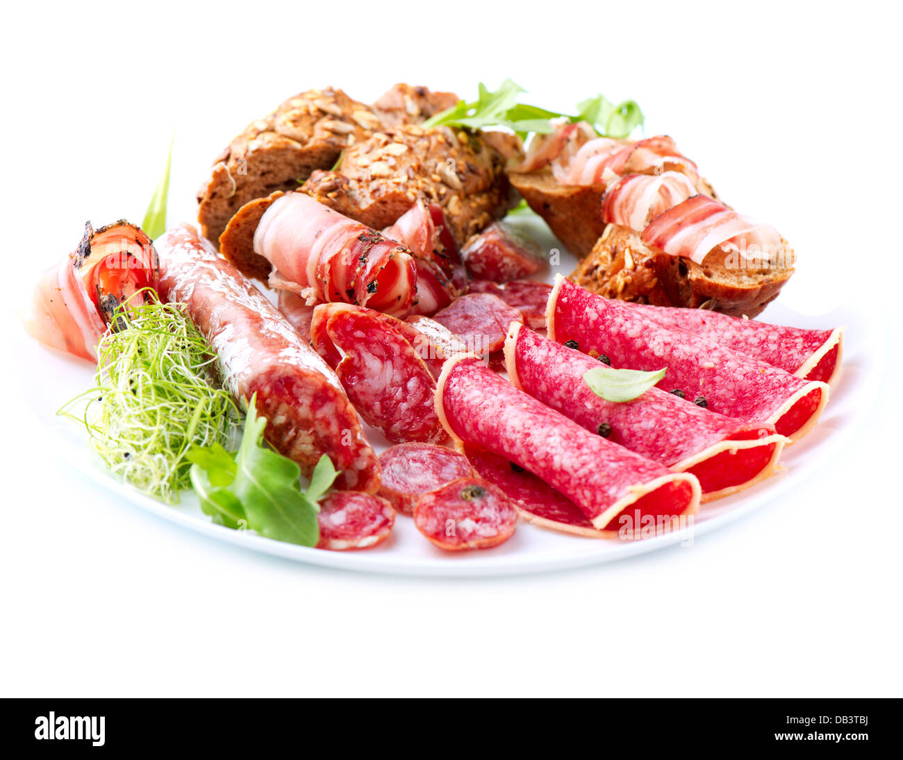 Sausage. Various Italian Ham, Salami and Bacon isolated on White Stock Photo