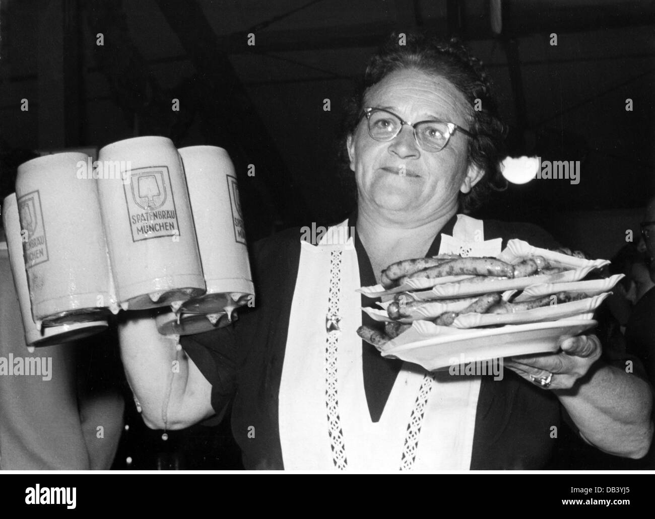 geography / travel, Germany, Munich, Oktoberfest, waitress with steins and plates with saugages and Sauerkraut, Schottenhamel Festzelt, 1950s, , Additional-Rights-Clearences-Not Available Stock Photo