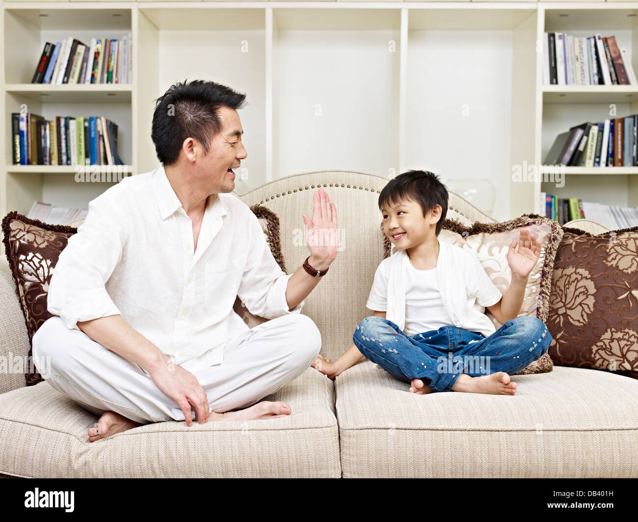 Father and son high five hi-res stock photography and images - Alamy