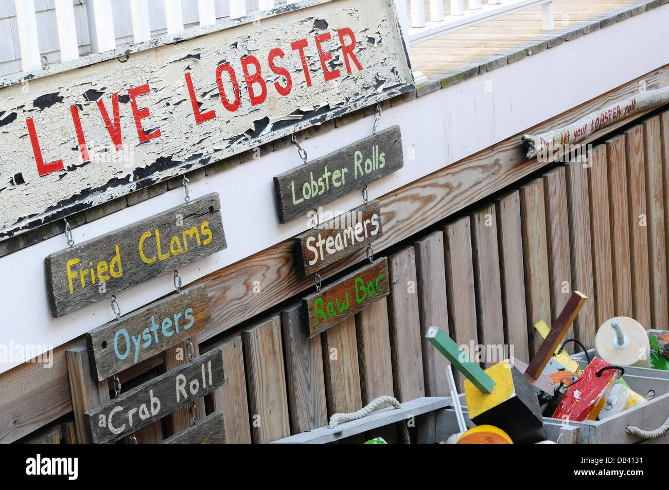 Live lobster and assorted other seafood signs Stock Photo