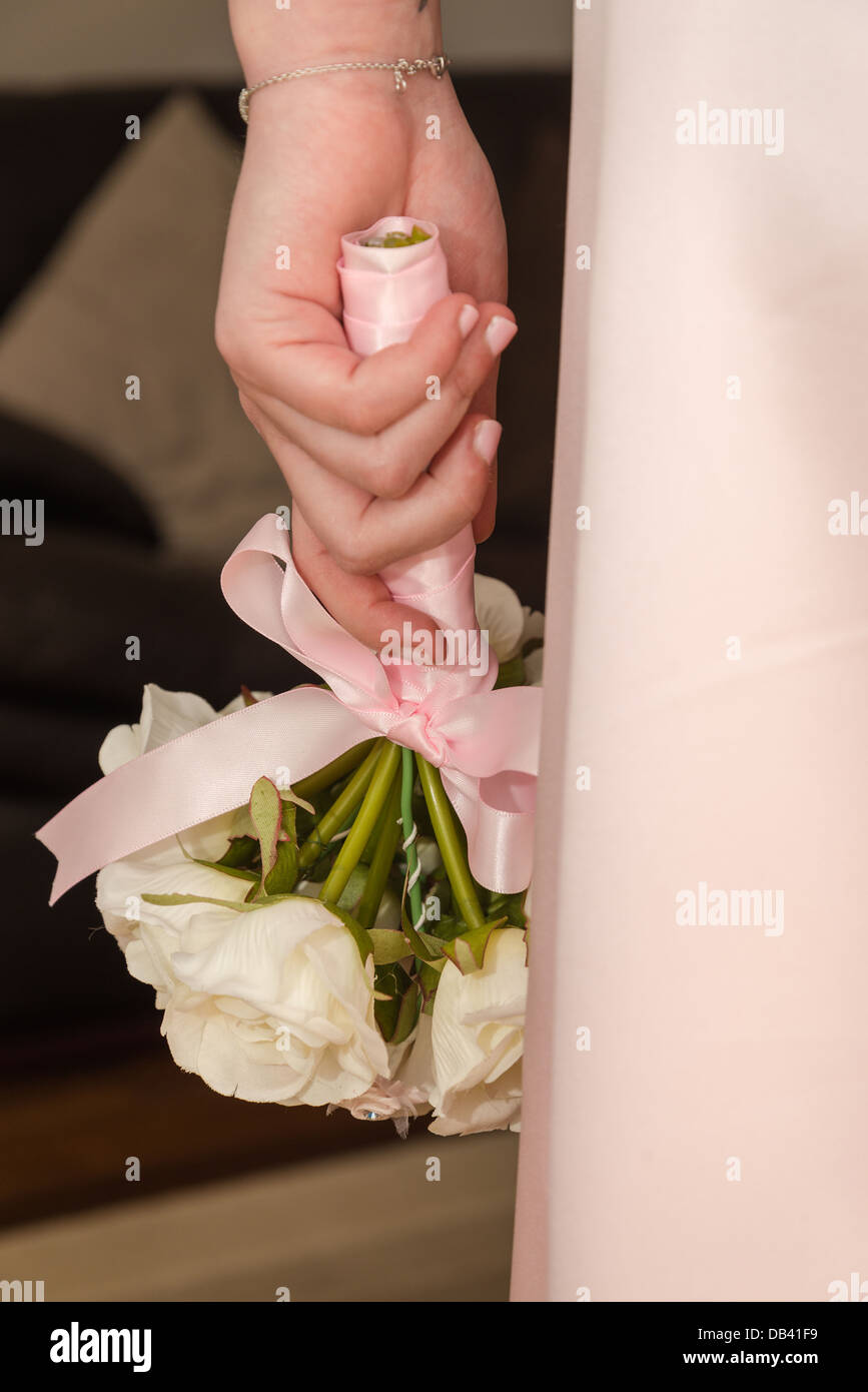 Close up of Bride holding bridal bouquet Stock Photo
