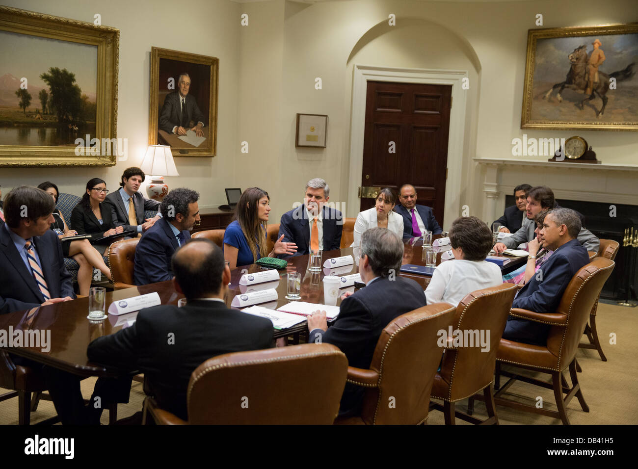 President Barack Obama holds an immigration reform roundtable with business owners and entrepreneurs in the Roosevelt Room of the White House, June 24, 2013. Stock Photo