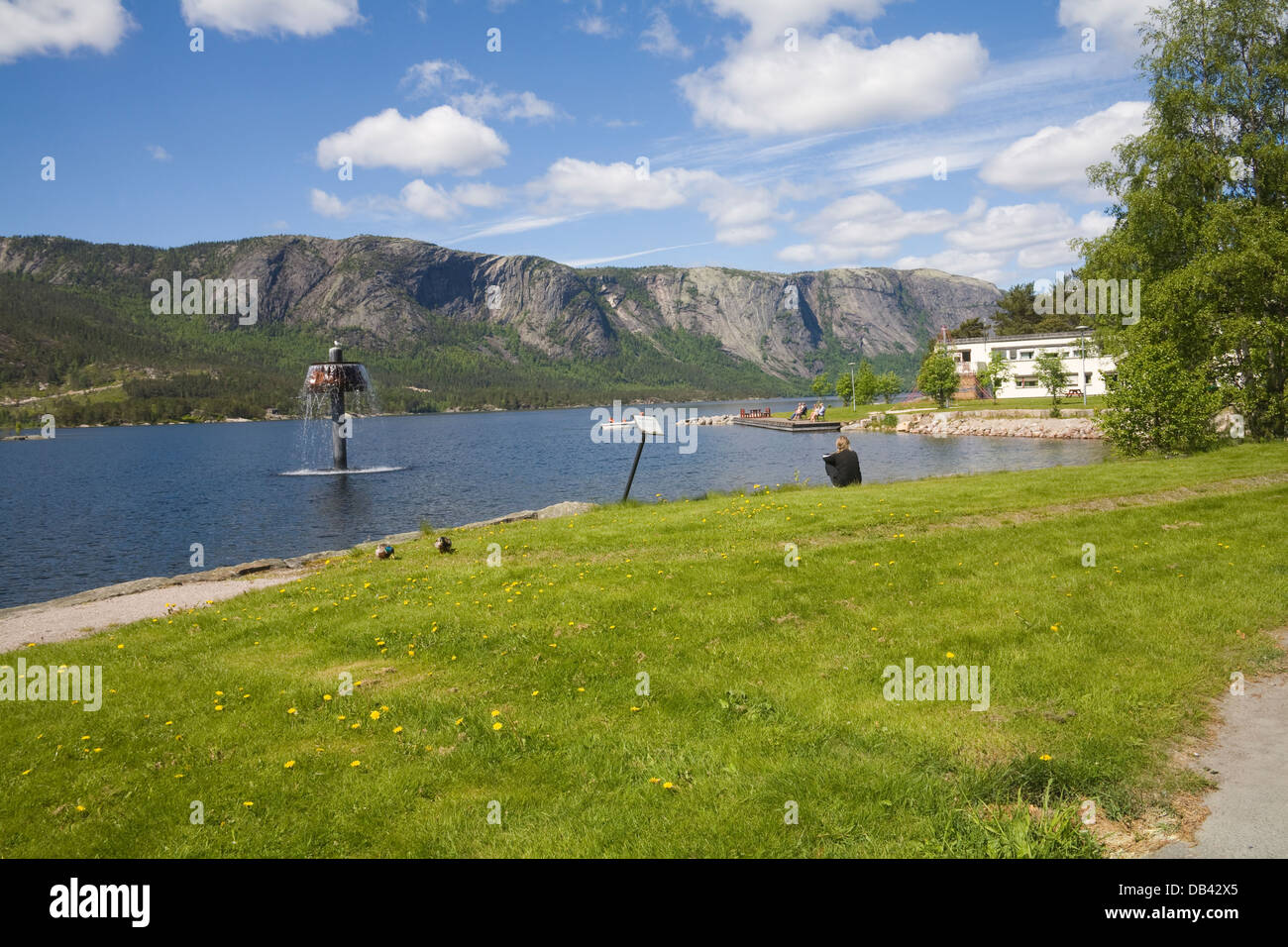 Treungen Telemark Norway Europe Visitors sitting viewing Lake Nisser in
