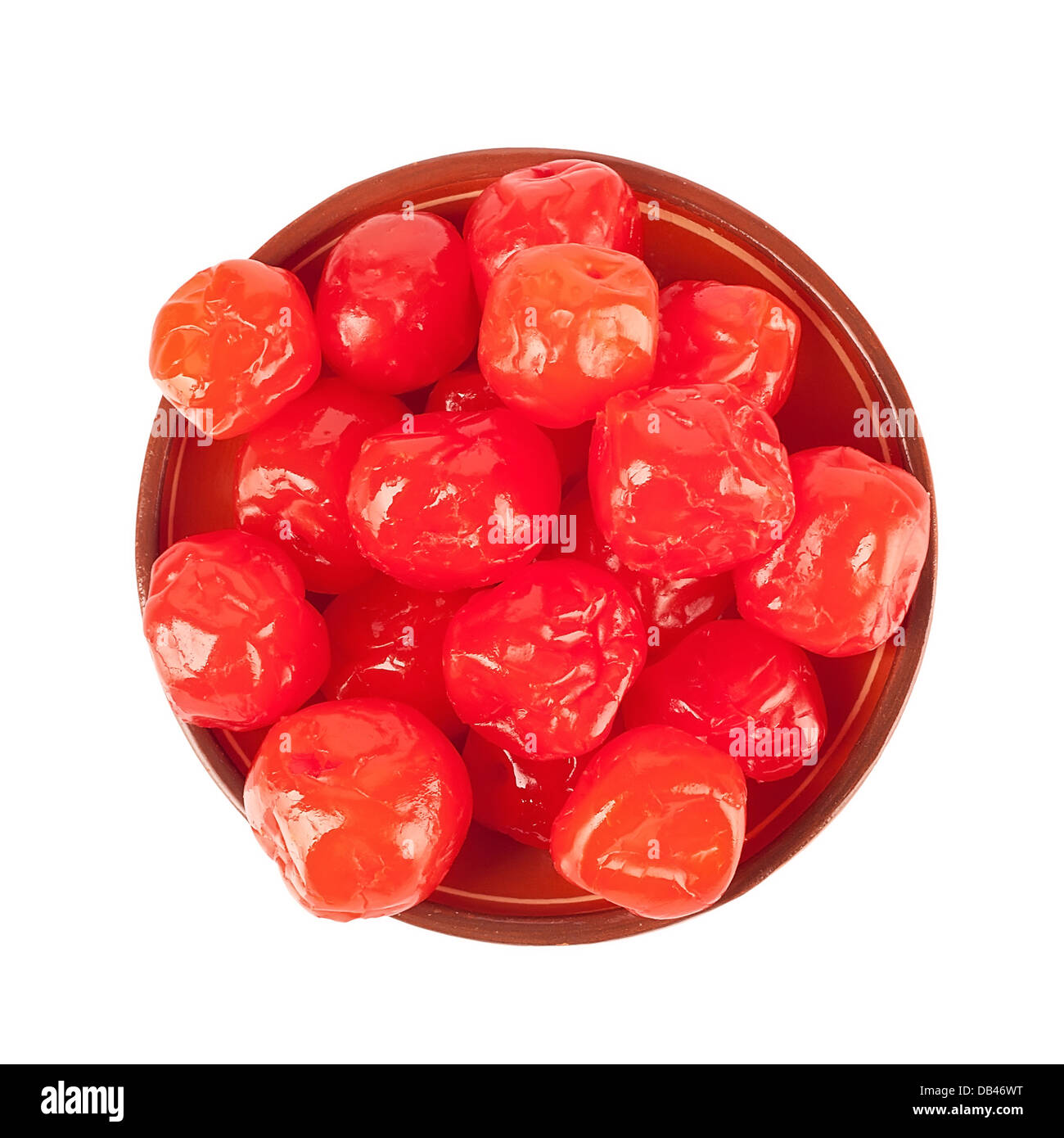Sun-dried cherries on ceramic dish, isolated over white Stock Photo