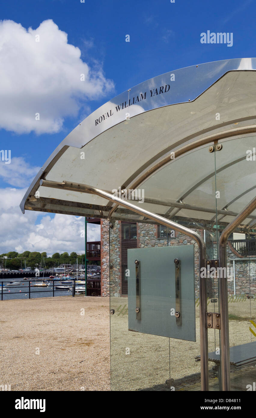 Steel and glass bus shelter outside Royal William Yard, Plymouth, Devon, UK Stock Photo