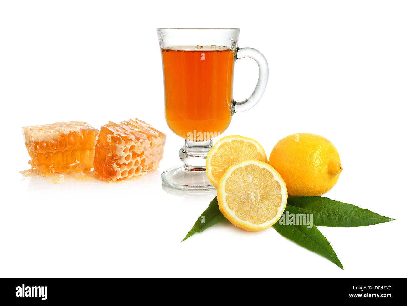 Hot tea in glass cup with lemon and honey on white background Stock